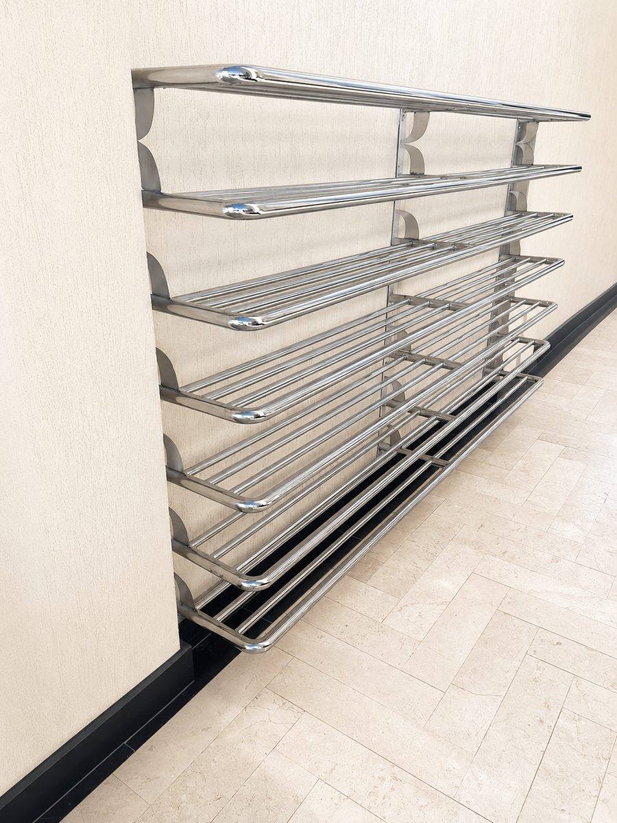 Polished stainless steel wall-mounted tubular rack, fabricated and installed